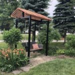 Featuring black powder coated posts and capped-top with custom swing.